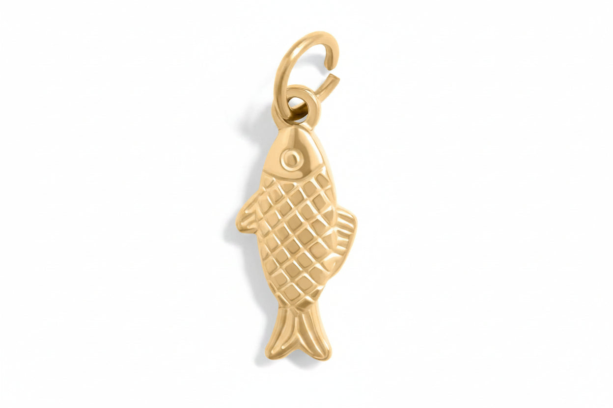 Gold fish-shaped pendant on a white background