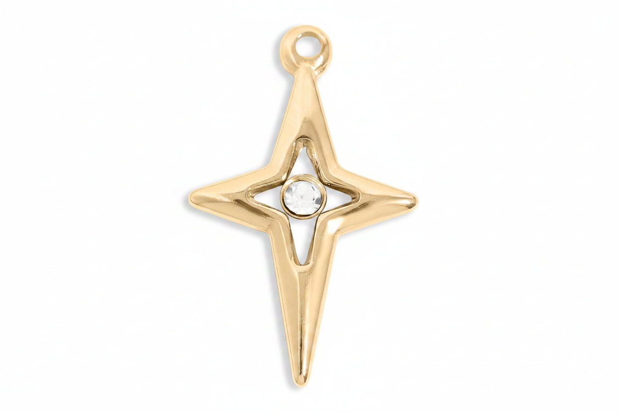 Gold star-shaped pendant with a central gemstone on a white background